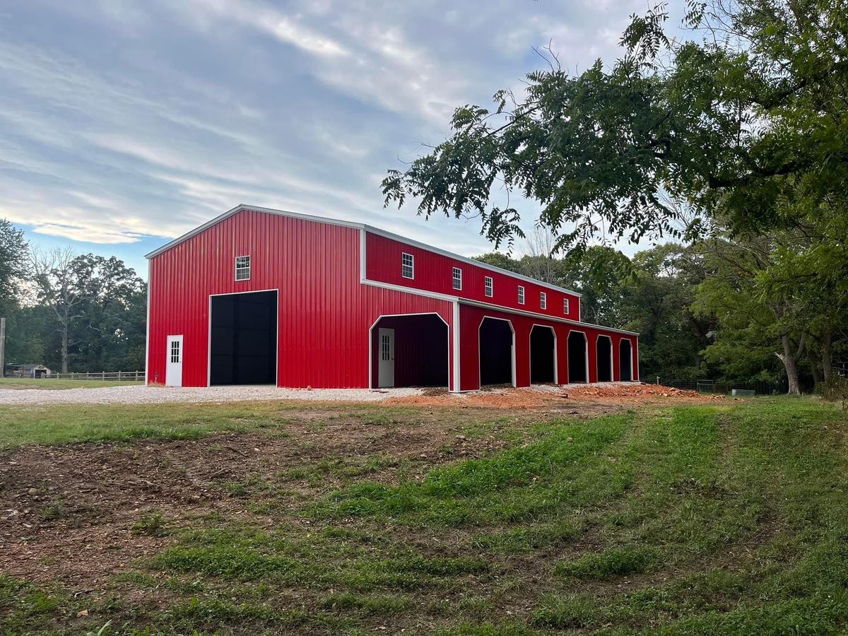 Large red Legacy truss-frame metal building